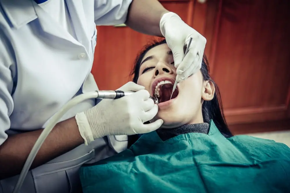 Dentist Treating Patient Teeth
