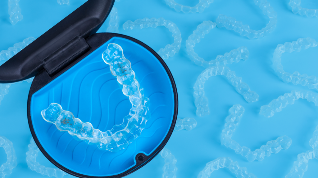 U-Smile Dental Club | Invisalign Teen: Why It’s the Clear Choice for Your Teenager Clear dental aligner in blue case.